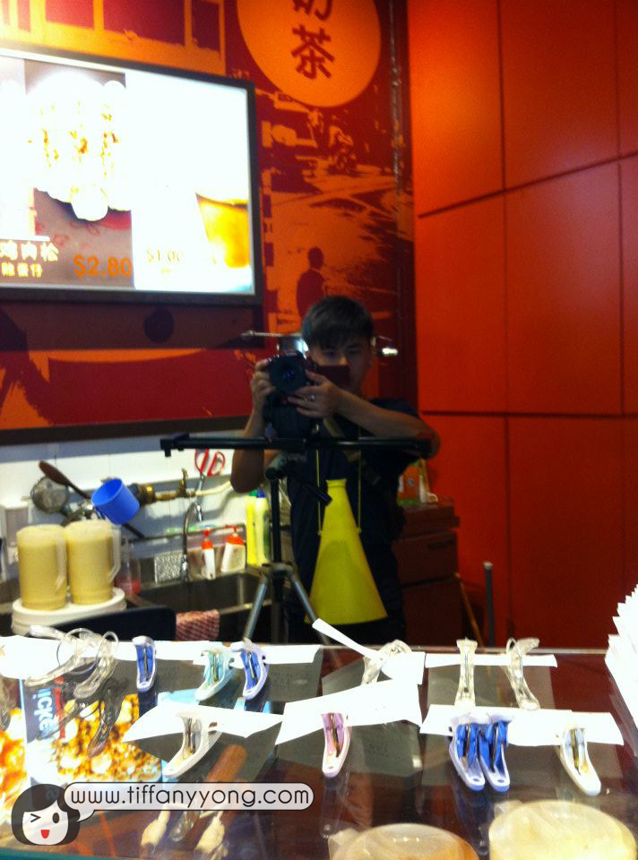 Director Lun filming from inside the store